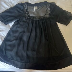 Fun top with sequin details.